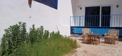 a table and chairs sitting outside of a building at Studio House Luxor in Luxor