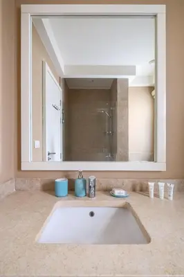 a sink in a bathroom with a large mirror at Joubal 2BR • Premium Ground Floor in Hurghada