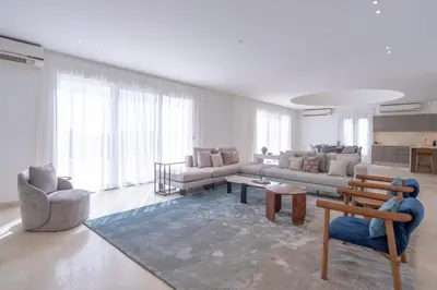 a large living room with a couch and chairs at Luxury 5BD Villa with Pool in Hurghada