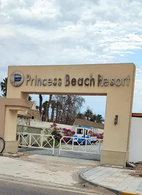 a sign for a princess beach resort on the street at Alhambra Avenue in Hurghada