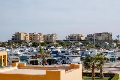 a bunch of boats parked in a marina at 2BR New Marina Bliss • Cozy Centered Stay in Hurghada