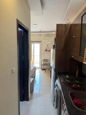 a kitchen with a sink and a refrigerator at Studio in Casablanca 631 in Hurghada