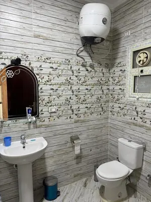 a bathroom with a toilet and a sink at Studio in Casablanca 631 in Hurghada