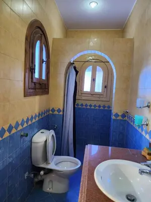a bathroom with a toilet and a sink at 2BD Apt, Douplex, 2 floors, Villa Yanny, El Helal, Hurghada in Hurghada