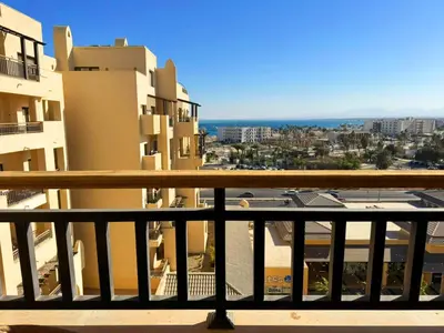 a view of a city from a balcony with buildings at Sea View Aldau Hights in Hurghada
