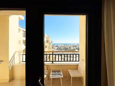 a view of a balcony from a room with a window at Sea View Aldau Hights in Hurghada