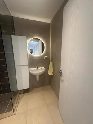 a bathroom with a sink and a mirror at Hotel apartment G Cribs Hotel in Hurghada