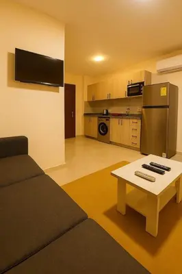 a living room with a couch and a table at Golden tiba resort in Hurghada