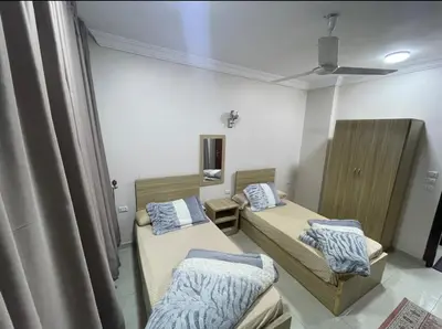 a room with two beds and a ceiling at Sea View Qussier in Quseir