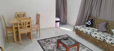 a living room with a couch and a table at Sea View Qussier in Quseir