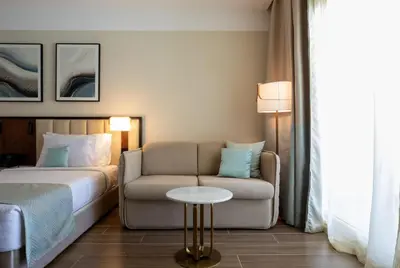 a hotel room with a couch and a bed at SRNTY Sahl Hasheesh - Ex Serenity Sky Arc in Hurghada