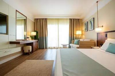 a hotel room with a large bed and a bathroom at SRNTY Sahl Hasheesh - Ex Serenity Sky Arc in Hurghada