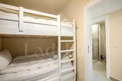 a bedroom with two bunk beds and a mirror at Ladybird - Veranda Celestia in Hurghada