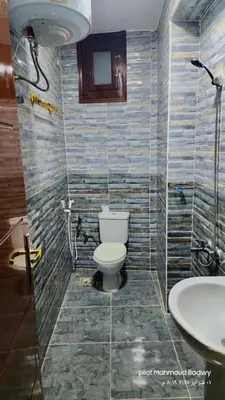 a bathroom with a toilet and a sink at sky spirit in Luxor