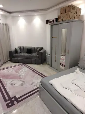 a living room with a bed and a couch at Hurghada Fiesta Resort Studio 328 in Hurghada