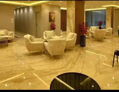 a lobby with couches and chairs in a building at Hurghada Fiesta Resort Studio 328 in Hurghada