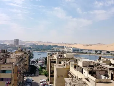 a view of a city with a river and buildings at اسوان ـ خلف مول بلازا ـ بجوار فرست مول in Aswān