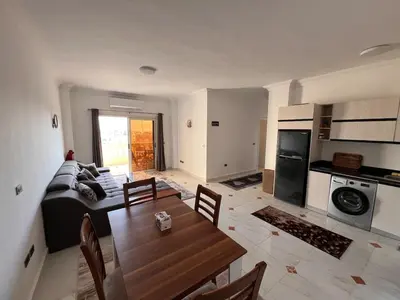 a living room with a couch and a table at Apartment with a Red Sea view in Hurghada