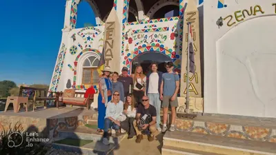 a group of people posing in front of a building at Zena Toma Nubian Guest House in Aswan