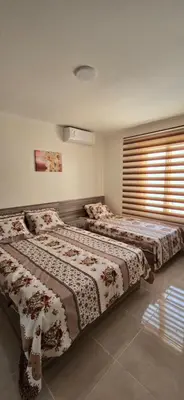 a bedroom with two beds in a room at Tiba Golden Marina Bay Hurghada in Hurghada