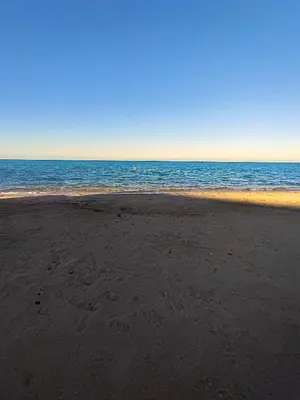 an empty beach with the ocean in the background at Oceanfront Apartment with Sea View - Hurghada - 2 bedrooms 2 bathrooms in Hurghada