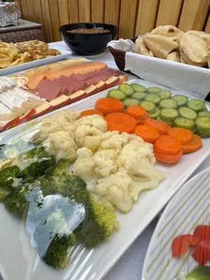 a plate of vegetables and other foods on a table at Nile Spirit Sunrise in Luxor