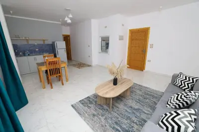 a living room with a couch and a table at Serenity House Luxor in Luxor