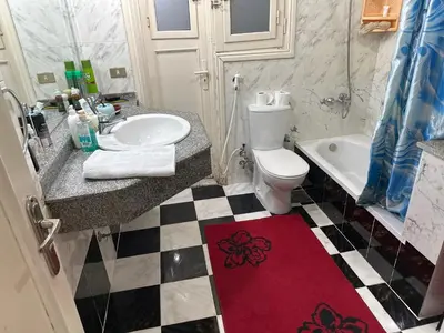 a bathroom with a sink and a toilet and a tub at Paradise Villa Seaview in Hurghada