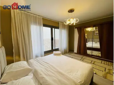 a bedroom with a large bed and a large mirror at 3 Bedroom In Bali Heated pool El Gouna in Hurghada