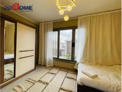 a bedroom with a bed and a large window at 3 Bedroom In Bali Heated pool El Gouna in Hurghada