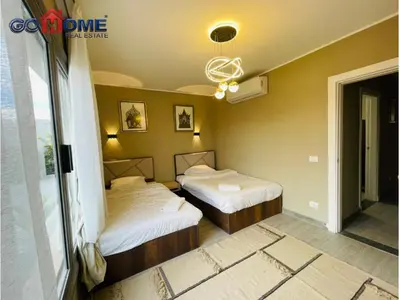 a bedroom with two beds and a window at 3 Bedroom In Bali Heated pool El Gouna in Hurghada