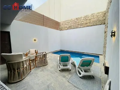 a waiting room with chairs and a swimming pool at 3 Bedroom In Bali Heated pool El Gouna in Hurghada