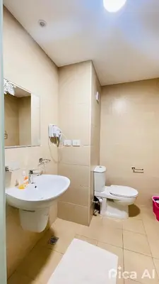 a bathroom with a sink and a toilet at Amazing Apartment Aldau Heights in Hurghada