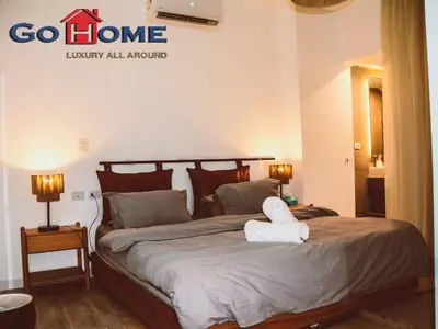 a bedroom with a bed with a towel on it at El Gouna 3 Bedroom in Sholan in Hurghada