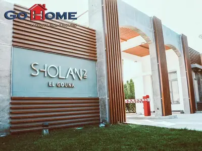 a sign for a store in front of a building at El Gouna 3 Bedroom in Sholan in Hurghada