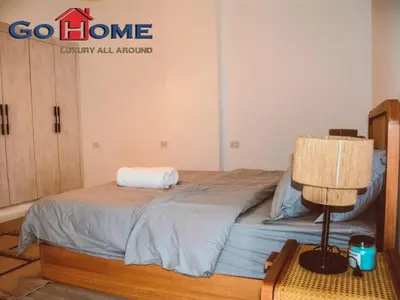 a bedroom with a bed with a towel on it at El Gouna 3 Bedroom in Sholan in Hurghada