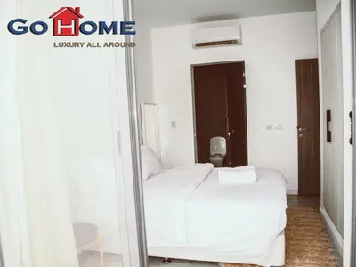 a white bed in a room with a mirror at El Gouna 3 Bedroom in Sholan in Hurghada