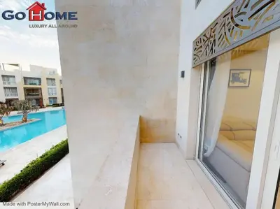 a room with a view of the swimming pool in a building at Mangroovy El-Gouna 1 Bedroom M7 -6B-13 in Hurghada