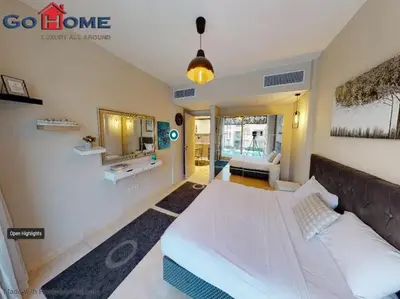 a bedroom with a bed and a couch in it at Mangroovy El-Gouna 1 Bedroom M7 -6B-13 in Hurghada