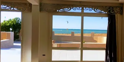 an open door with a view of the beach at Al-Kiam Villa Private pool A F in Hurghada