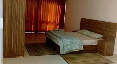 a bedroom with a bed and a window at Al-Kiam Villa Private pool A F in Hurghada