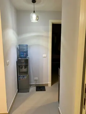 a hallway with a room with a machine in it at lovely 2 bedrooms Groundfloor in Hurghada