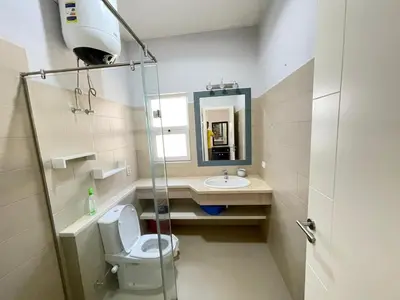 a bathroom with a toilet and a sink and a shower at lovely 2 bedrooms Groundfloor in Hurghada