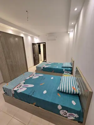 two twin beds in a room at Florenza Khamsin in Hurghada