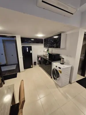 a kitchen with a stove and a counter top at Florenza Khamsin in Hurghada