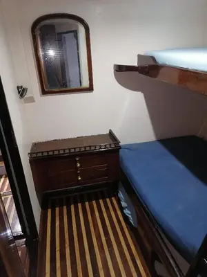 a bedroom with a bed and a mirror on the wall at Zafeer in Hurghada