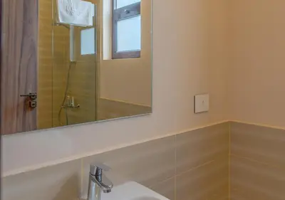 a bathroom with a sink and a mirror at Ancient Sands Gouna 4BR Villa Heated Pool & Lagoon in Hurghada