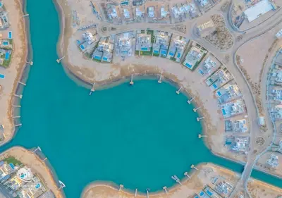 an overhead view of a city with houses and water at Ancient Sands Gouna 4BR Villa Heated Pool & Lagoon in Hurghada
