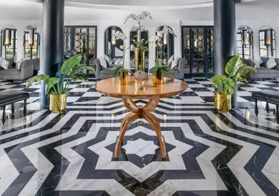 a lobby with a table and potted plants at Luxor Or Aswan Nile Cruise, Ultra Deluxe Cruises sailing 3, 4, Or 7 Nights in Luxor