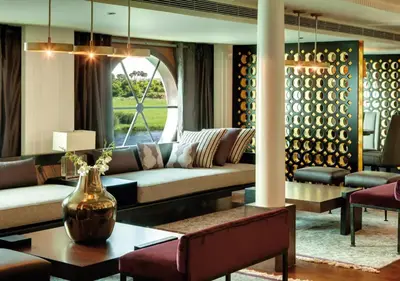 a living room with a couch and a table at Luxor Or Aswan Nile Cruise, Ultra Deluxe Cruises sailing 3, 4, Or 7 Nights in Luxor